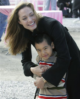 Illustration for article titled Brad's Sleepy Eyes; Johnny's Scuffed Shoes; Angelina & Maddox